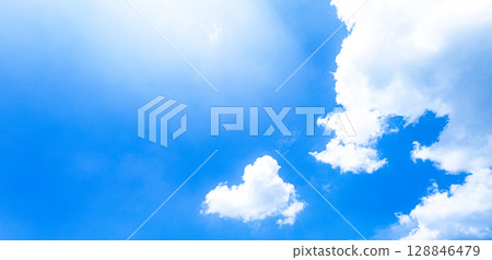 A simple landscape of a refreshing blue sky and white clouds 128846479