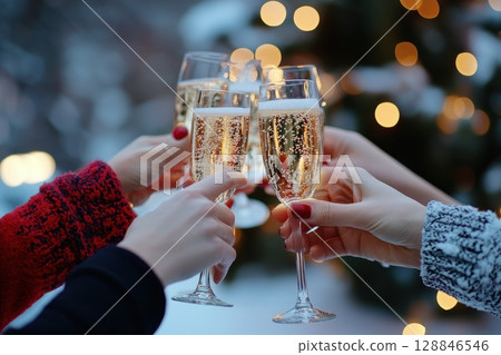 Joyful Friends Toasting with Drinks in Celebration 128846546