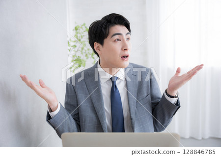 Giving a 'don't give up' pose in front of the computer - I can't do it anymore! Giving a 'don't give up' pose in front of the computer - I can't do it anymore! 128846785