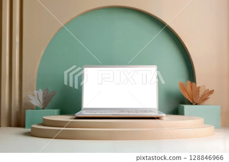 laptop with blank screen on beige podium and turquoise wall 128846966