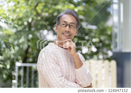 Smiling man in his early 60s 128847152