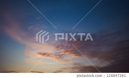 Clouds and blue sky dyed by the setting sun - Film-like 128847261