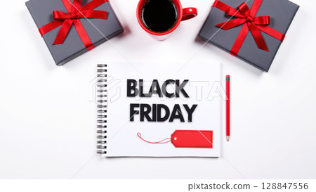 text black friday on notebook with red cup of coffee and gift boxes with red ribbon, top view text black friday on notebook with red cup of coffee and gift boxes with red ribbon, top view 128847556