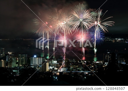 Lakeside street lights and Lake Suwa fireworks festival 128848507