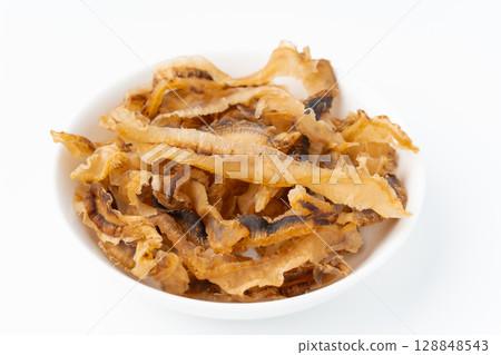Scallops on a plate on a white background 128848543