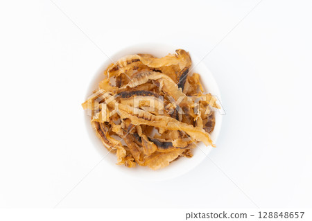 Scallops on a plate on a white background 128848657