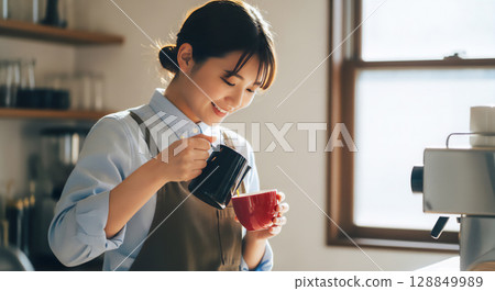 Young female staff working at a coffee shop 128849989