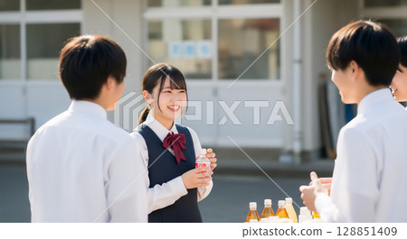 Students interacting at a high school cultural festival Students interacting at a high school cultural festival 128851409
