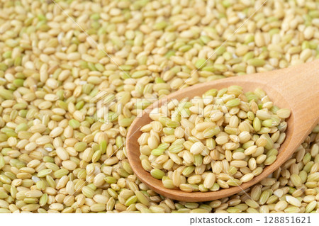 Close-up of green rice on a spoon 128851621