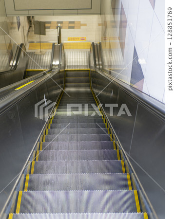 Escalators in a train station Escalators in a train station 128851769