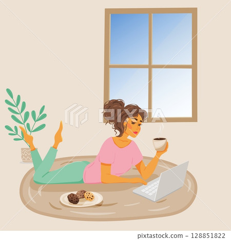 Woman working on laptop with coffee and cookies 128851822