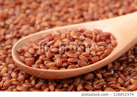 Close-up of red rice on a spoon Close-up of red rice on a spoon 128852374