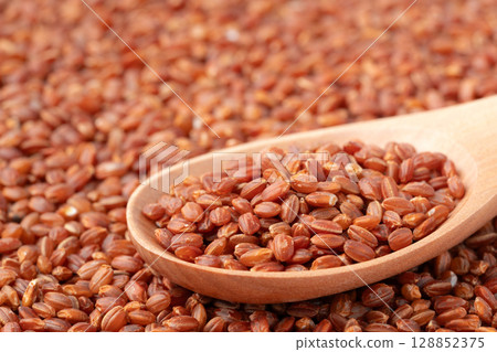 Close-up of red rice on a spoon 128852375