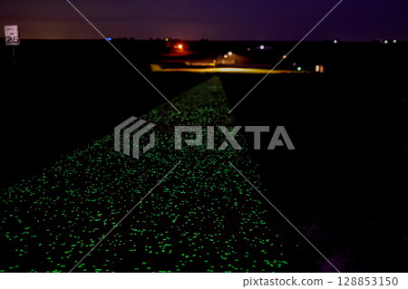A section glow-in-the-dark concrete sidewalk along Nathan's Miles Glow Trail in Vinton, Iowa, USA 128853150