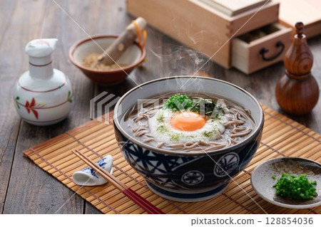 Steaming grated yam soba noodles Japanese style soba dish with egg yolk and spring onion 128854036