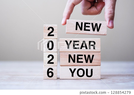 hand holding wooden block with text 2026 NEW YEAR NEW YOU on table background. Resolution, strategy, goal, business and holiday concepts hand holding wooden block with text 2026 NEW YEAR NEW YOU on table background. Resolution, strategy, goal, business and holiday concepts 128854279
