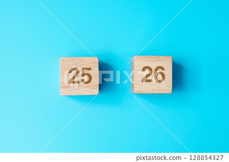 wooden cube block with 2026 text on blue background. Resolution, plan, review, goal, start and New Year holiday concepts wooden cube block with 2026 text on blue background. Resolution, plan, review, goal, start and New Year holiday concepts 128854327