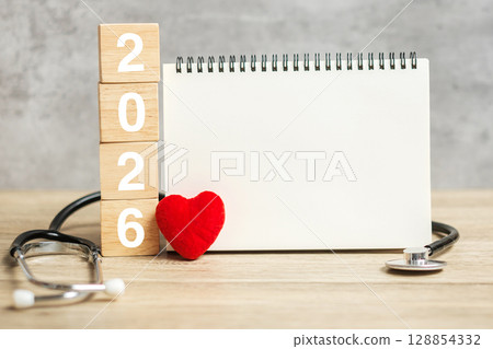 2026 Happy New Year for healthcare, Insurance, Wellness and medical concept. Stethoscope and blank notebook for copy space your text 128854332