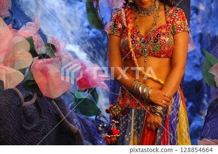 Elegant Indian Woman in Traditional Attire with Sensual Grace Elegant Indian Woman in Traditional Attire with Sensual Grace 128854664