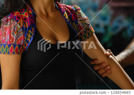 Elegant Indian Woman in Traditional Attire with Sensual Grace 128854665