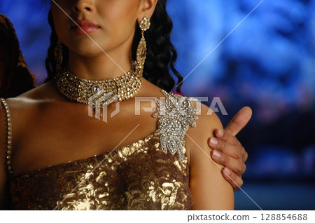 Elegant Indian Woman in Traditional Attire with Sensual Grace Elegant Indian Woman in Traditional Attire with Sensual Grace 128854688