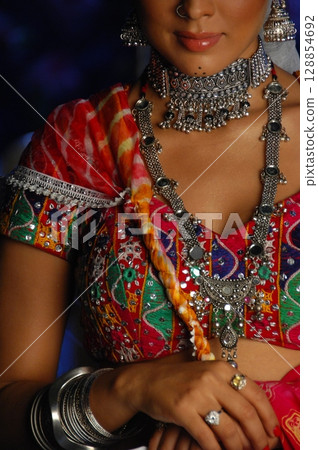 Elegant Indian Woman in Traditional Attire with Sensual Grace 128854692