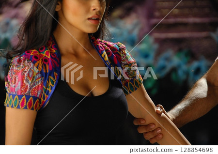 Elegant Indian Woman in Traditional Attire with Sensual Grace Elegant Indian Woman in Traditional Attire with Sensual Grace 128854698