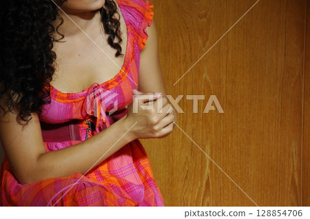 Elegant Indian Woman in Traditional Attire with Sensual Grace 128854706