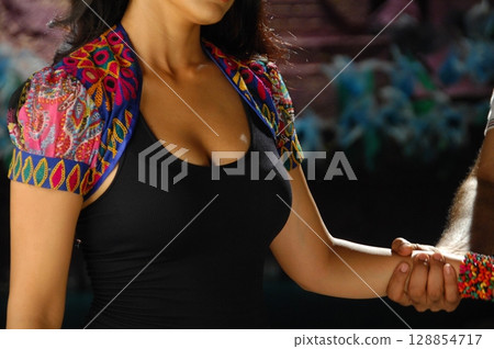 Elegant Indian Woman in Traditional Attire with Sensual Grace 128854717