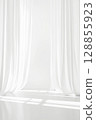 Minimalistic background with white transparent curtains. Light room with tulle 128855923