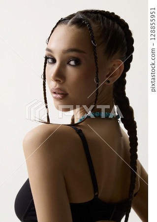 beautiful girl with braids, make-up and jewelry 128855951