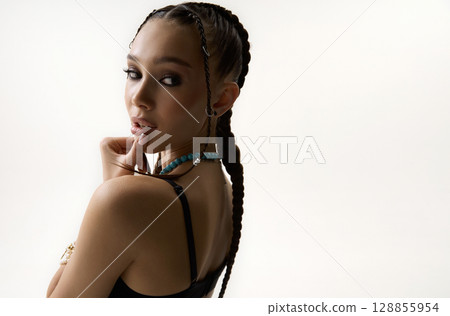 beautiful girl with braids. tressed hairstyle. latin hip-hop style 128855954