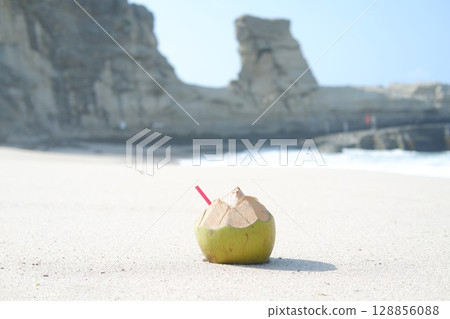 Fresh Coconut on a Sandy Beach 128856088