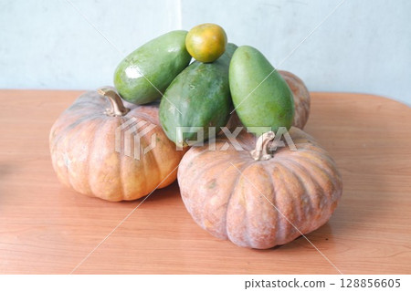 Mixed Tropical Fruits with Pumpkins and Papayas 128856605