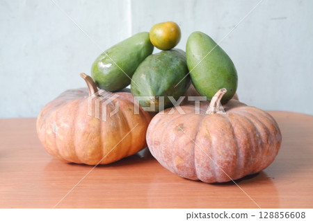 Mixed Tropical Fruits with Pumpkins and Papayas Mixed Tropical Fruits with Pumpkins and Papayas 128856608