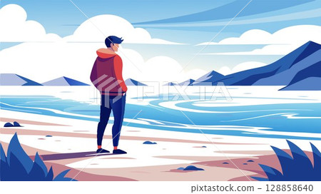 A solitary figure, a young man, finds solace in the solitude of a winter beach, the rhythmic sound of the waves providing a calming backdrop. 128858640