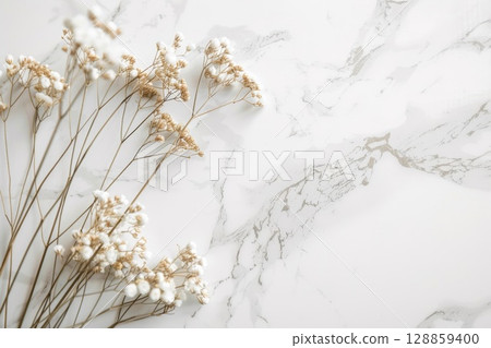 Marble and dried flowers background 128859400