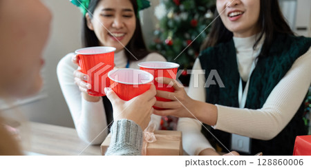 Festive Business Christmas Party Celebration with Colleagues Enjoying Holiday Cheer and Red Cups Festive Business Christmas Party Celebration with Colleagues Enjoying Holiday Cheer and Red Cups 128860006