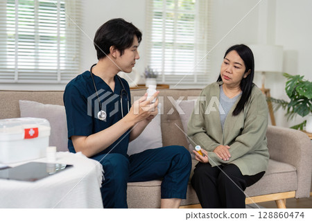 Healthcare Professional Consulting with Patient in Modern Medical Office Setting Healthcare Professional Consulting with Patient in Modern Medical Office Setting 128860474