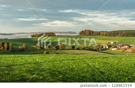 Panoramic view of rolling green hills and farmhouses, Witthoh, Hegau, Baden-Wuerttemberg, Germany Panoramic view of rolling green hills and farmhouses, Witthoh, Hegau, Baden-Wuerttemberg, Germany 128861554