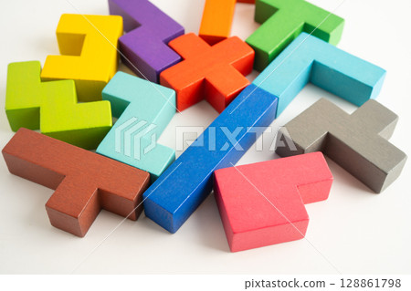 Logical thinking and problem solving creative business solution concept, wooden puzzle geometric shape block shape. Logical thinking and problem solving creative business solution concept, wooden puzzle geometric shape block shape. 128861798