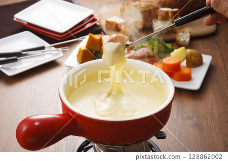 Cheese fondue: Cheese on baguette Cheese fondue: Cheese on baguette 128862002
