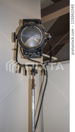 Shot of the old, vintage light projector used during movie production 128862048