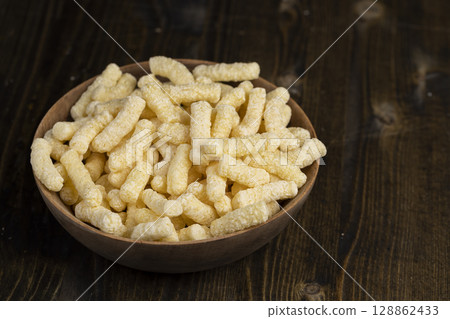 a large number of corn sticks for eating or making breakfast with milk, corn sticks in a wooden bowl a large number of corn sticks for eating or making breakfast with milk, corn sticks in a wooden bowl 128862433