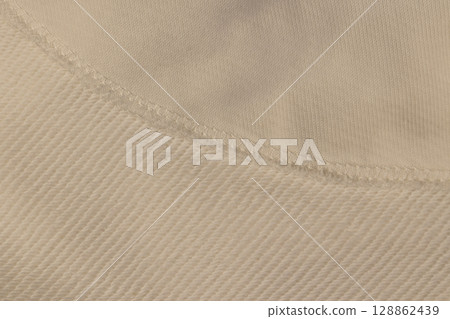 white cotton fabric for the production of clothing, a piece of clothing sewn from different parts 128862439