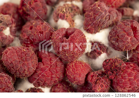 mold-covered overripe spoiled red raspberries mold-covered overripe spoiled red raspberries 128862546
