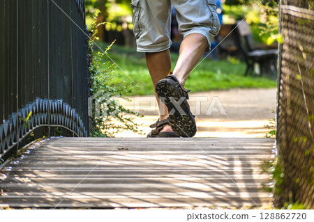 Man walking on a path, helathy activity to make exercice 128862720