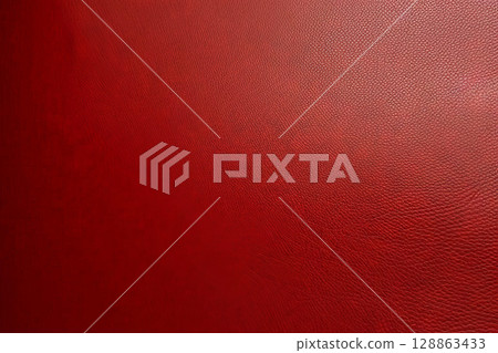 Close-up of deep red textured leather surface, detailed background with natural grain pattern and rich color, perfect for luxury, fashion, and upholstery design concepts 128863433