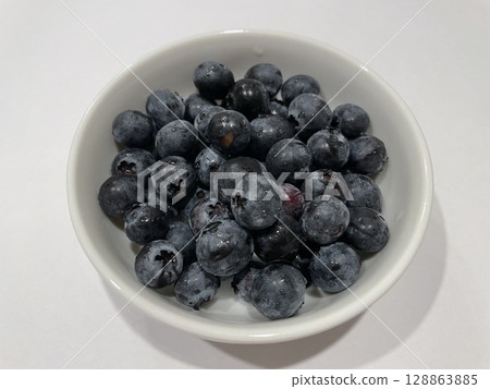 Fresh blueberries in a white bowl 007 128863885