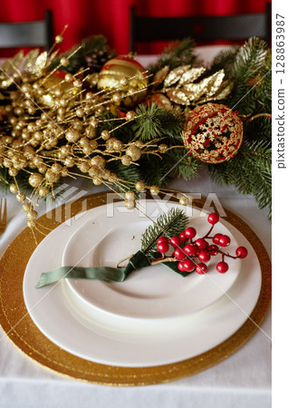 white plate on table with new year decor white plate on table with new year decor 128863987